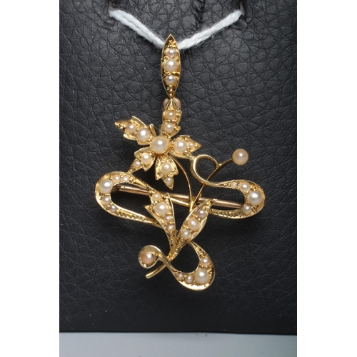 273 - A LATE VICTORIAN SEED PEARL FLOWER SPRAY PENDANT/BROOCH to a plain unmarked frame