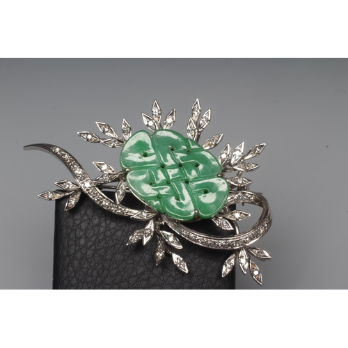 277 - A DIAMOND AND JADE FLOWER SPRAY BROOCH, the central quatrefoil jade panel incise carved and dot pier... 