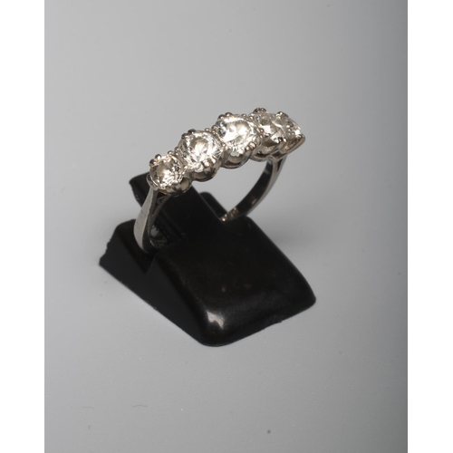 282 - A FIVE STONE DIAMOND RING, the central brilliant cut stone of approximately 0.5cts flanked by four s... 