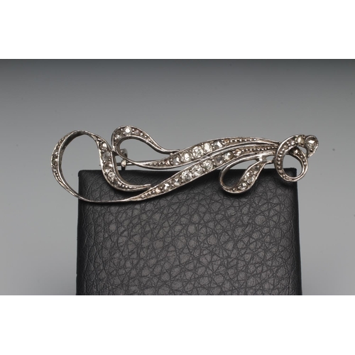 285 - A VICTORIAN DIAMOND BROOCH, the abstract feather spray pave set with numerous small stones to an unm... 