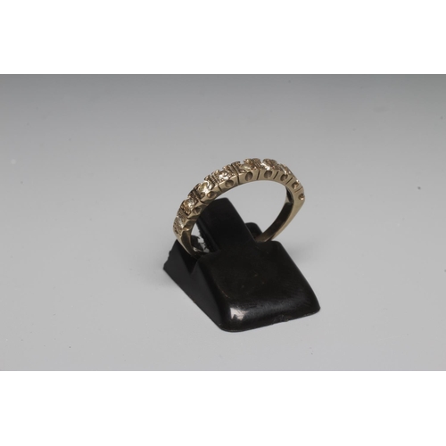 286 - A NINE STONE DIAMOND HALF HOOP ETERNITY RING, the small brilliant cut stones claw set to a plain sha... 