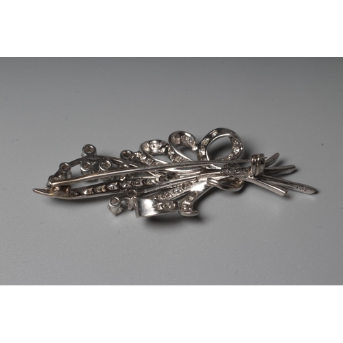 287 - A DIAMOND SPRAY BROOCH, the numerous brilliant cut stones claw and pave set to a white frame, applie... 
