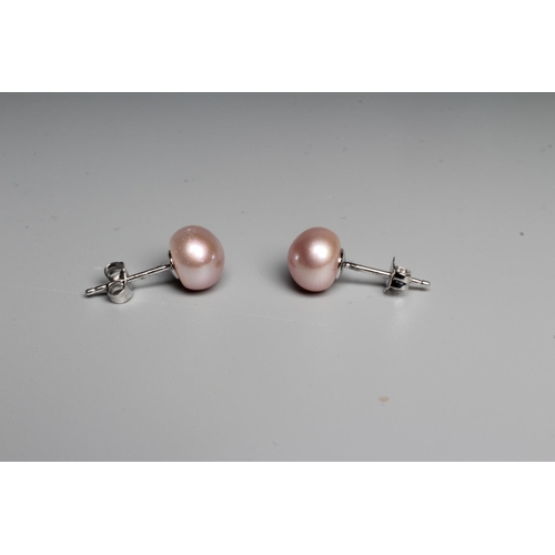 288 - A PAIR OF CULTURED PEARL EAR STUDS, the pale pink peg set pearls on 9ct white gold posts with butter... 
