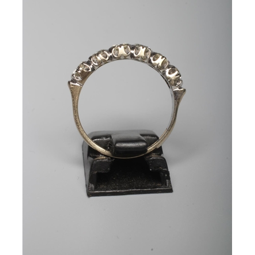 289 - A SIX STONE DIAMOND HALF HOOP RING, the brilliant cut stones point set to a plain 18ct gold shank, L... 