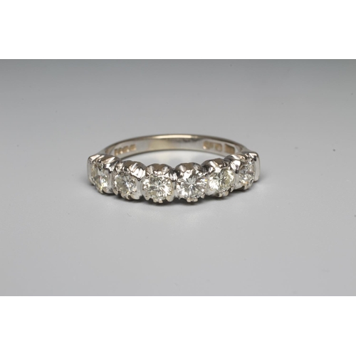 289 - A SIX STONE DIAMOND HALF HOOP RING, the brilliant cut stones point set to a plain 18ct gold shank, L... 