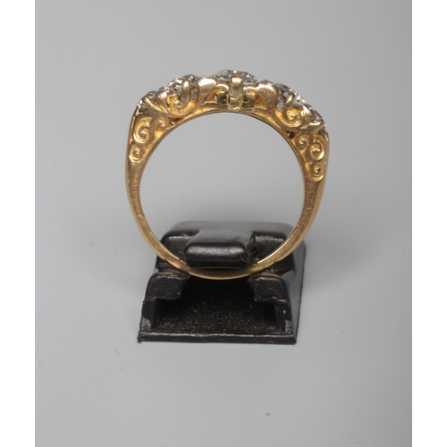 291 - A FIVE STONE DIAMOND RING, the central brilliant cut stone of approximately 0.7cts claw set and flan... 