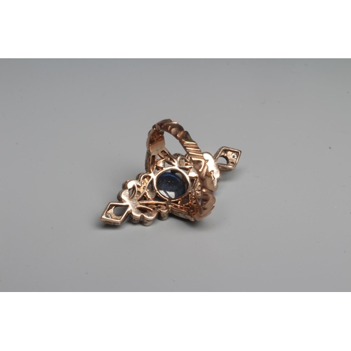 296 - A GEORGIAN STYLE MARQUISE DRESS RING, the central cabochon polished circular sapphire claw set to an... 