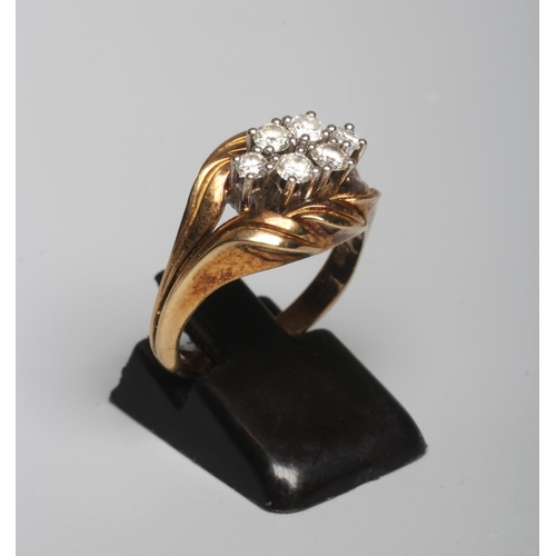 298 - A SIX STONE DIAMOND RING, the brilliant cut stones totalling 0.52cts, all claw set to a rope twist m... 