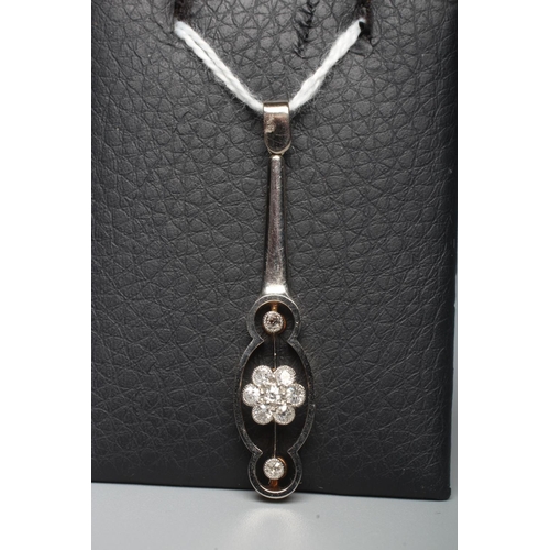 300 - AN ART DECO DIAMOND PENDANT, the flared open bar centred by a seven stone cluster with a further dia... 