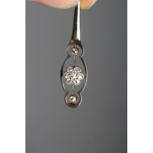 300 - AN ART DECO DIAMOND PENDANT, the flared open bar centred by a seven stone cluster with a further dia... 