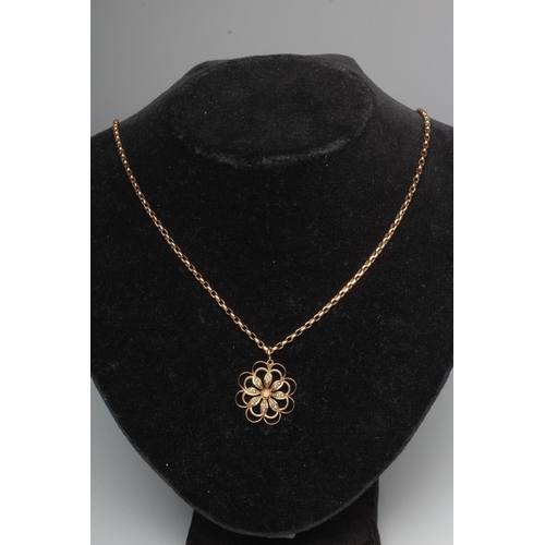 303 - A LATE VICTORIAN SEED PEARL FLOWERHEAD PENDANT, unmarked and hung on a belcher link chain necklace w... 