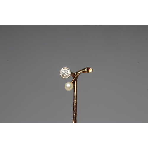 307 - A VICTORIAN DIAMOND AND PEARL STICK PIN, the brilliant cut diamond collet set with a peg set small p... 