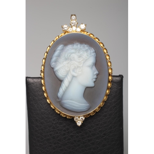 308 - A BLUE AGATE CAMEO BROOCH/PENDANT, the oval blue panel carved with the head and shoulders portrait o... 