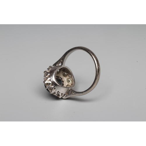 311 - A SAPPHIRE AND DIAMOND RING, the oval facet cut sapphire claw set to a border of ten brilliant cut d... 