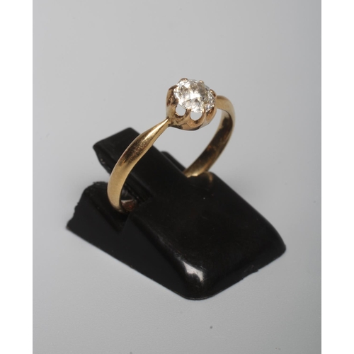 314 - A SOLITAIRE DIAMOND RING, the old brillant cut stone of approximately 0.30cts, claw set to a plain y... 