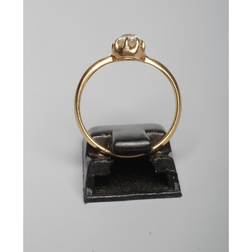 314 - A SOLITAIRE DIAMOND RING, the old brillant cut stone of approximately 0.30cts, claw set to a plain y... 