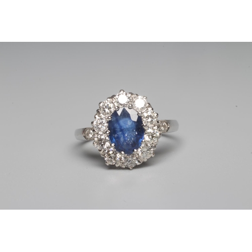 316 - A SAPPHIRE AND DIAMOND CLUSTER RING, the oval facet cut sapphire of approximately 1.50cts, claw set ... 