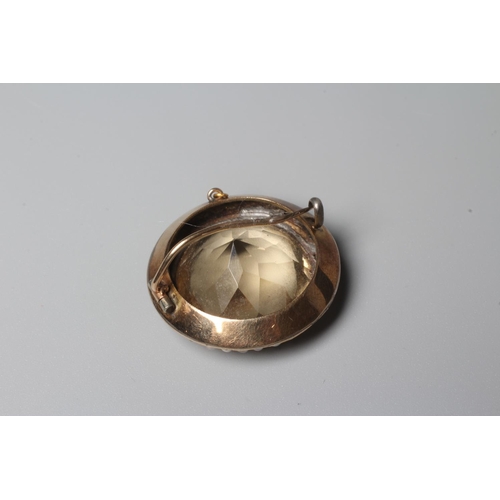 321 - A VICTORIAN CITRINE AND SEED PEARL BOSS BROOCH, the facet cut circular citrine open back collet set ... 