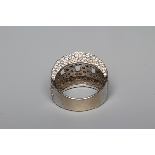 322 - A DIAMOND COCKTAIL RING, the central open rope twist graduated panel within deep borders, all pave s... 
