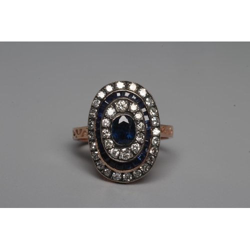 324 - A SAPPHIRE AND DIAMOND DRESS RING, the central oval facet cut sapphire within a border of twelve rou... 