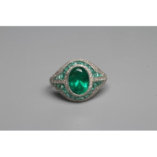 327 - AN ART DECO STYLE EMERALD AND DIAMOND COCKTAIL RING, the central oval facet cut emerald of 1.37cts, ... 