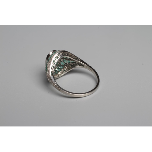 327 - AN ART DECO STYLE EMERALD AND DIAMOND COCKTAIL RING, the central oval facet cut emerald of 1.37cts, ... 