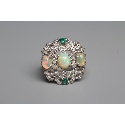 329 - A THREE STONE OPAL DRESS RING, the oval cabochon polished stones claw set to a fancy open frame set ... 