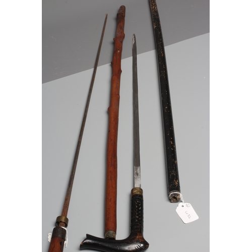 380 - TW0 ANGLO INDIAN SWORD STICKS, one possibly 19th century with carved monkey head grip and 29 1/4