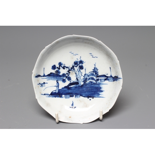 36 - AN ENGLISH PORCELAIN SAUCER, c.1755, of dished circular form with barbed rim, painted in underglaze ... 