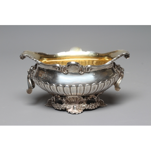 159 - AN EDWARD VII SILVER OVAL BOWL by Wm. Hutton, London 1903, the semi fluted bowl with everted scroll ... 