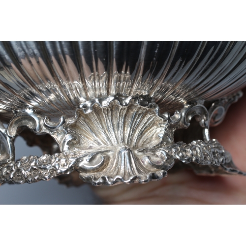 159 - AN EDWARD VII SILVER OVAL BOWL by Wm. Hutton, London 1903, the semi fluted bowl with everted scroll ... 
