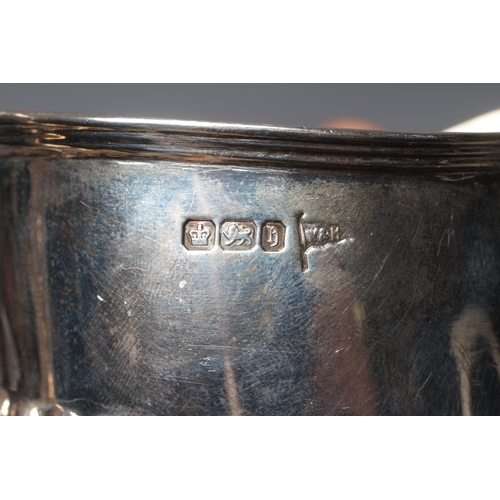 173 - A LATE VICTORIAN SILVER MILK JUG by Walker & Hall, Sheffield 1900, of semi fluted oval form with ang... 