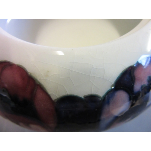 48 - A MOORCROFT ANEMONE BOWL AND COVER, mid 20th century, in typical palette on a white ground, signed i... 