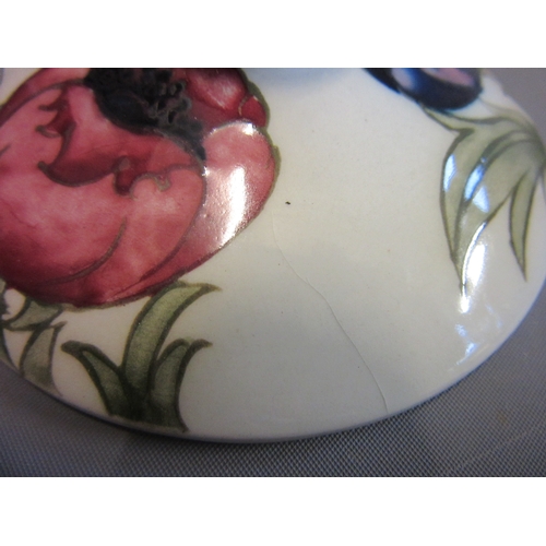 48 - A MOORCROFT ANEMONE BOWL AND COVER, mid 20th century, in typical palette on a white ground, signed i... 