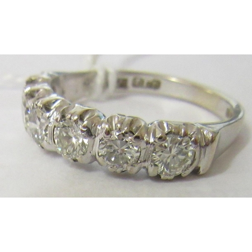 289 - A SIX STONE DIAMOND HALF HOOP RING, the brilliant cut stones point set to a plain 18ct gold shank, L... 