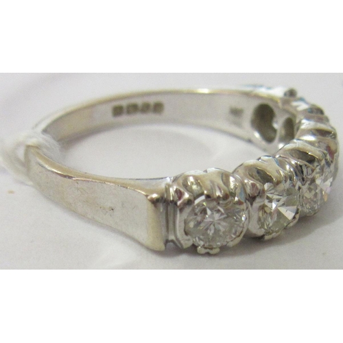 289 - A SIX STONE DIAMOND HALF HOOP RING, the brilliant cut stones point set to a plain 18ct gold shank, L... 