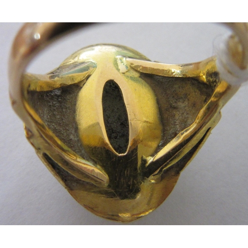 343 - A CHINESE RING, the oval cabochon polished jade panel claw set to stepped shoulders and a plain gold... 