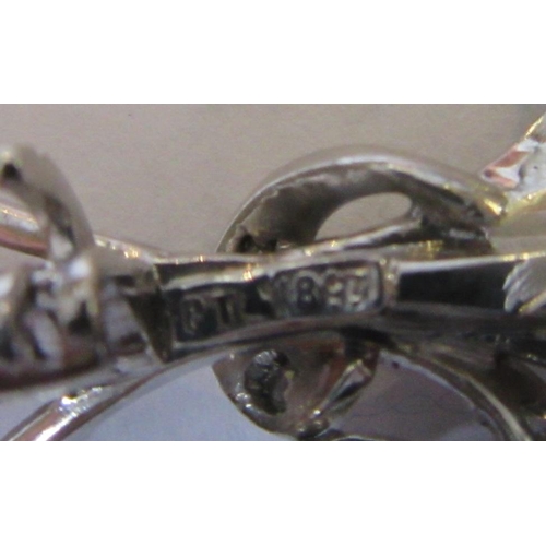 287 - A DIAMOND SPRAY BROOCH, the numerous brilliant cut stones claw and pave set to a white frame, applie... 