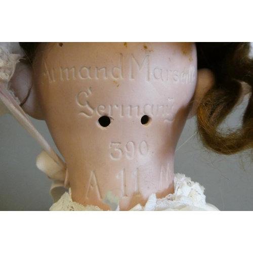101 - A large Armand Marseille bisque socket head doll, with brown glass sleeping eyes, open mouth, teeth,... 