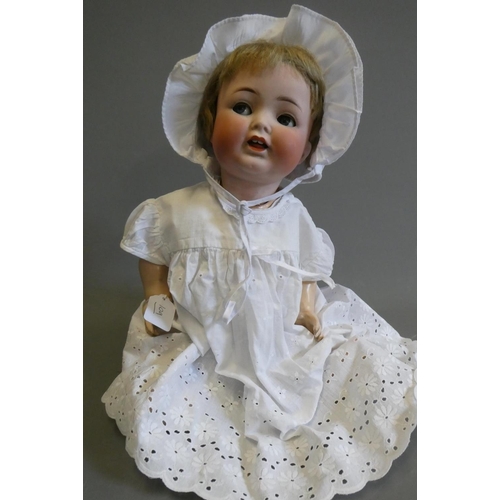 109 - A Heubach Koppelsdorf bisque socket head flirty doll, with blue glass sideways glancing eyes, metal ... 