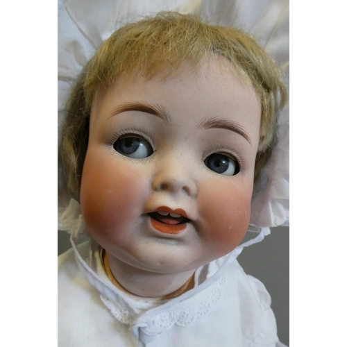 109 - A Heubach Koppelsdorf bisque socket head flirty doll, with blue glass sideways glancing eyes, metal ... 