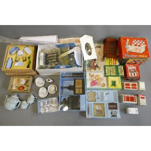 111 - Doll's house furniture and accessories, including wood and metal fixtures, boxed light fittings, kit... 