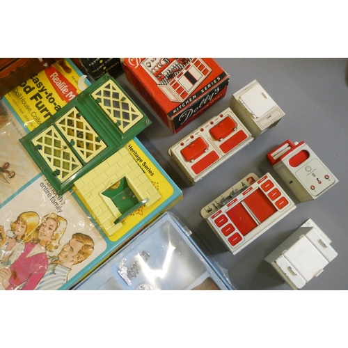 111 - Doll's house furniture and accessories, including wood and metal fixtures, boxed light fittings, kit... 