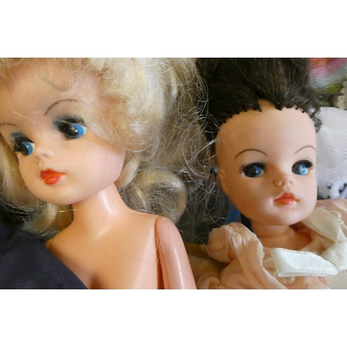 112 - Four Sindy dolls and a collection of Sindy associated clothing and accessories (qty)