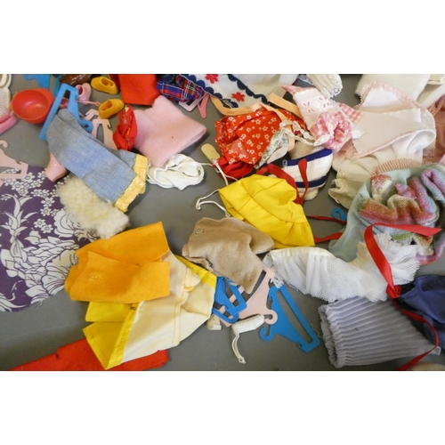 112 - Four Sindy dolls and a collection of Sindy associated clothing and accessories (qty)