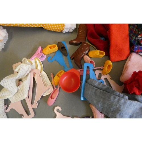 112 - Four Sindy dolls and a collection of Sindy associated clothing and accessories (qty)