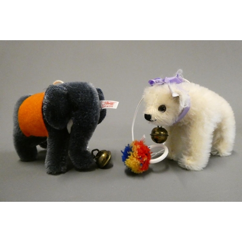122 - Two Steiff miniature animals, comprising a white bear on all fours and an Elephant, both with bells ... 