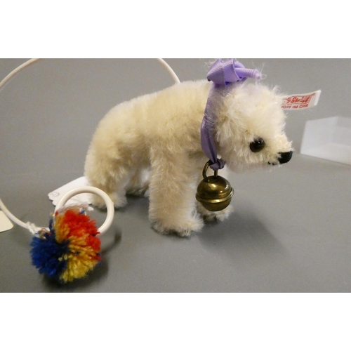 122 - Two Steiff miniature animals, comprising a white bear on all fours and an Elephant, both with bells ... 