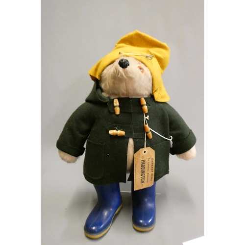 128 - Vintage Paddington bear, with orange felt hat, green felt coat, blue Dunlop boots and cardboard labe... 