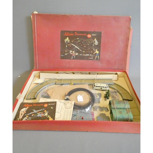 269 - Schuco Varianto 3010 Set with clockwork bus and track parts, box AF, models good
